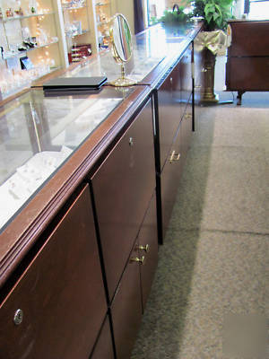 Set of 9 jewelry display showcases, glass and mahogany