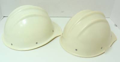  2 white bullard fiberglass 502 hard hats