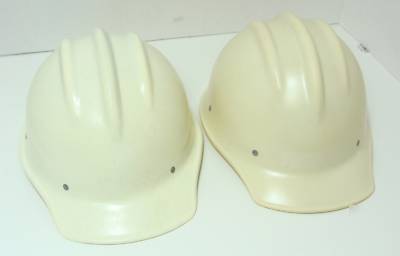  2 white bullard fiberglass 502 hard hats