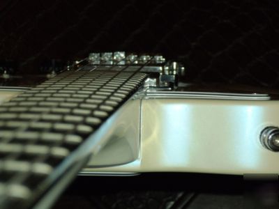 Patent for sale: adjustable neck-angle joint for guitar