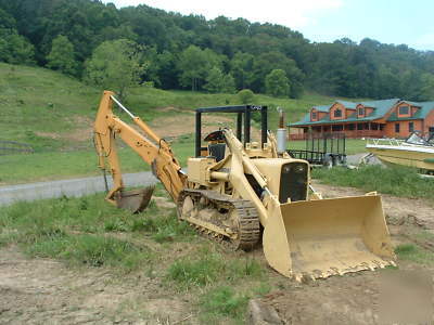 New john deere track hoe and loader with motor.