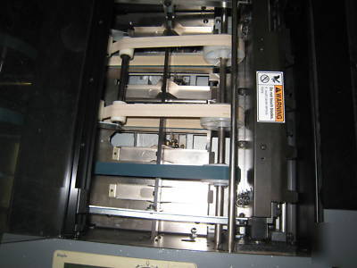 Bookletmaker / trimmer, setfeeder, sadlestitched books