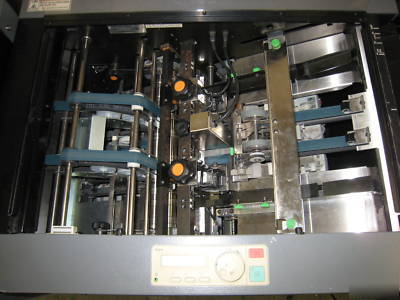 Bookletmaker / trimmer, setfeeder, sadlestitched books