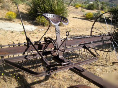 Antique horse drawn hay rake
