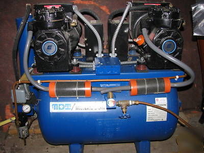 Mckesson dual head 230V dental compressor works good. 