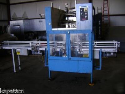 Styrotech ST1100 sleeve labeler - 1 gallon containers